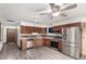 Updated kitchen featuring stainless steel appliances, ample cabinet space, and wood-look floors at 710 4Th St, Bennett, CO 80102