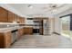 Bright kitchen featuring stainless steel appliances, plenty of cabinets, and sliding glass doors to the patio at 710 4Th St, Bennett, CO 80102