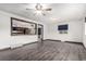 Open-concept living area with views into the kitchen and wood-look floors at 710 4Th St, Bennett, CO 80102