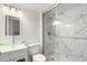Modern bathroom with a glass bowl sink, toilet, and tiled shower with glass door at 772 Ivywood Ct, Highlands Ranch, CO 80126