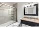 Bathroom with granite countertop and tiled shower/tub combo at 772 Ivywood Ct, Highlands Ranch, CO 80126