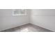 Cozy room featuring laminate floors, white trim and a window at 772 Ivywood Ct, Highlands Ranch, CO 80126