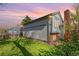 Exterior view of the home with a well-kept lawn and beautiful garden beds at 772 Ivywood Ct, Highlands Ranch, CO 80126