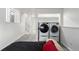 Bright laundry room space featuring modern washer and dryer units and neutral paint at 772 Ivywood Ct, Highlands Ranch, CO 80126