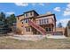 Backyard with a deck, a patio, and a retaining wall at 6374 Arapahoe Ct, Parker, CO 80134