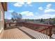 Wooden deck with railing offering an open view of the surrounding neighborhood at 6374 Arapahoe Ct, Parker, CO 80134