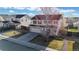 Overhead view of a charming home with a two-car garage and landscaped surroundings at 13684 Lilac St, Thornton, CO 80602
