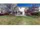 Lush backyard with trees and a stone patio ideal for outdoor gatherings and quiet relaxation at 13684 Lilac St, Thornton, CO 80602