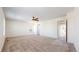 Spacious bedroom featuring three windows for natural light, carpet, and ceiling fan at 13684 Lilac St, Thornton, CO 80602