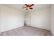 Bedroom with comfortable carpeting, neutral tones and an open door to another room at 13684 Lilac St, Thornton, CO 80602