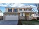 Two-story home with two-car garage and landscaping at 13684 Lilac St, Thornton, CO 80602