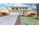 Charming two-story home featuring a two-car garage and landscaped front yard at 13684 Lilac St, Thornton, CO 80602