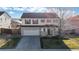 Suburban two-story home featuring a two-car garage, neutral siding, and landscaping at 13684 Lilac St, Thornton, CO 80602