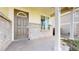 Charming front porch with decorative door and brick accents at 13684 Lilac St, Thornton, CO 80602