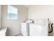 Bright laundry room with window and washer and dryer hookups at 13684 Lilac St, Thornton, CO 80602