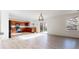Open-concept living area flows into the kitchen with stainless steel appliances, creating an inviting and modern living space at 13684 Lilac St, Thornton, CO 80602