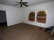 Spacious bedroom features ceiling fan, windows and space for renovation at 5500 Dacono Ct, Byers, CO 80103