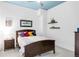 Cozy bedroom with stylish decor, featuring colorful pillows and a ceiling fan at 3401 Arapahoe Ave # 105, Boulder, CO 80303