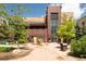 Attractive building entrance with brick facade, modern glass doors, and lush greenery creating a welcoming ambiance at 3401 Arapahoe Ave # 105, Boulder, CO 80303