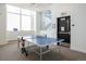 Game room with a table tennis setup and natural light at 3401 Arapahoe Ave # 105, Boulder, CO 80303
