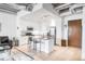 Modern kitchen with white cabinetry, stainless steel appliances, and an island with bar seating at 3401 Arapahoe Ave # 105, Boulder, CO 80303