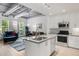 Bright open kitchen featuring stainless steel appliances and access to the living area and balcony at 3401 Arapahoe Ave # 105, Boulder, CO 80303