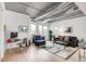 A well-lit living room offers a comfortable workspace and access to a private balcony at 3401 Arapahoe Ave # 105, Boulder, CO 80303
