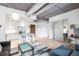 Open living space with stainless steel appliances, kitchen island and modern design at 3401 Arapahoe Ave # 105, Boulder, CO 80303