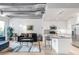 This living area features modern decor, an open floor plan, and a stainless-steel kitchen at 3401 Arapahoe Ave # 105, Boulder, CO 80303