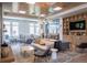Relaxing lounge area featuring a sofa, chairs, and a built in entertainment center at 3401 Arapahoe Ave # 105, Boulder, CO 80303