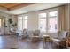Bright lounge space featuring lounge chairs, small tables and large windows at 3401 Arapahoe Ave # 105, Boulder, CO 80303