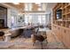 Comfortable lounge area with a sofa, chairs, and a built in entertainment center at 3401 Arapahoe Ave # 105, Boulder, CO 80303