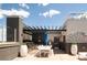 Outdoor kitchen with a built-in grill, dining area, and stylish accents at 3401 Arapahoe Ave # 105, Boulder, CO 80303