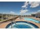 Inviting rooftop pool and spa with panoramic city and mountain views at 3401 Arapahoe Ave # 105, Boulder, CO 80303