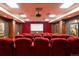 Comfortable movie theater room with plush red seating and a large screen at 3401 Arapahoe Ave # 105, Boulder, CO 80303