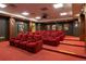 Private theater room with tiered seating, classic movie posters, and a warm ambiance at 3401 Arapahoe Ave # 105, Boulder, CO 80303