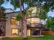 Rear exterior showcasing multi-level decks and mature trees at 10954 W 100Th Way, Broomfield, CO 80021