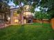 Spacious, landscaped backyard with deck, lawn, and mature trees at 10954 W 100Th Way, Broomfield, CO 80021
