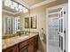 Bathroom featuring elegant vanity, large mirror, and tub with shower at 10954 W 100Th Way, Broomfield, CO 80021