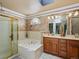 Relaxing bathroom boasts soaking tub and double sinks with elegant finishes and a separate shower at 10954 W 100Th Way, Broomfield, CO 80021