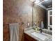 Bathroom with granite countertop, elegant fixtures, and decorative painted walls at 10954 W 100Th Way, Broomfield, CO 80021