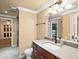 Bathroom featuring a light countertop vanity and a large mirror with a view into the next room at 10954 W 100Th Way, Broomfield, CO 80021