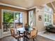 Dining area with patio access featuring hardwood floors and plenty of natural light at 10954 W 100Th Way, Broomfield, CO 80021