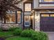 Close-up of home's front door and stone facade at 10954 W 100Th Way, Broomfield, CO 80021
