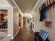 Inviting hallway with hardwood floors and views into the kitchen and other living spaces at 10954 W 100Th Way, Broomfield, CO 80021