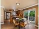 Bright kitchen with wood floors, stainless steel appliances, and a sliding glass door to the outdoor patio at 10954 W 100Th Way, Broomfield, CO 80021