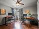 Office with hardwood floors, natural light, and two sit-stand desks, perfect for working from home at 10954 W 100Th Way, Broomfield, CO 80021