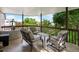 Covered outdoor seating area overlooking treed backyard at 10954 W 100Th Way, Broomfield, CO 80021