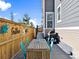 Cozy fenced patio area with outdoor dining set and a grill, perfect for gatherings at 17616 Bluetrail Ave, Parker, CO 80134