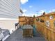 Charming fenced patio with a wooden table and chairs; great for outdoor entertaining at 17616 Bluetrail Ave, Parker, CO 80134